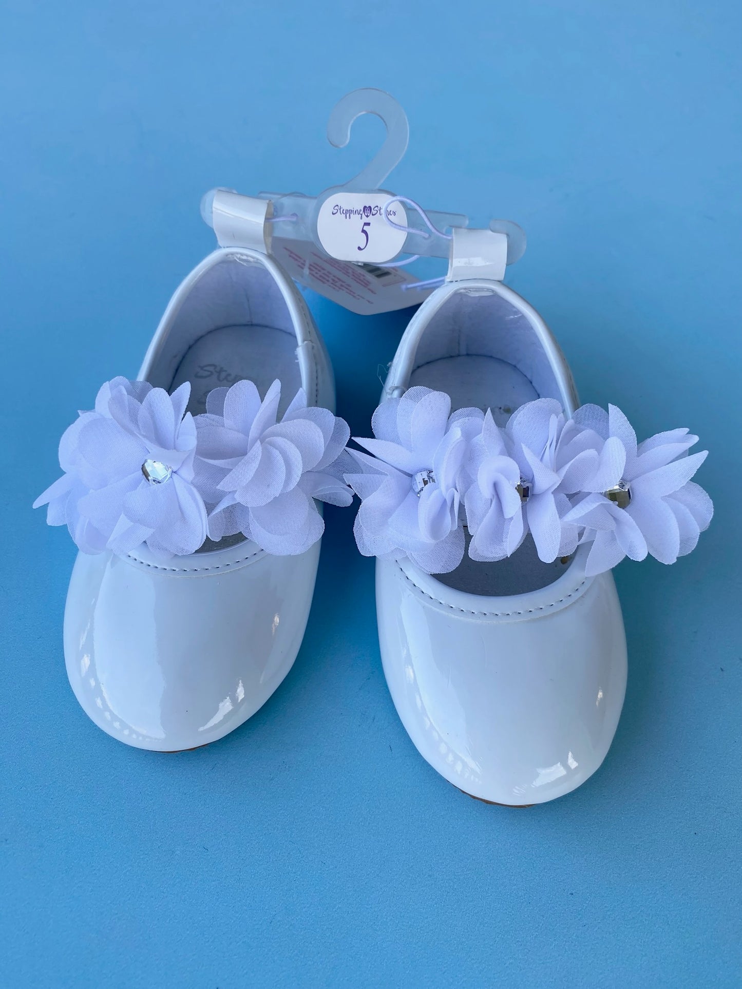 ZAPATOS NIÑA FLORES BLANCO CON SUELA